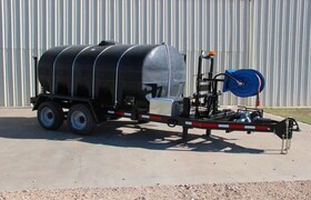 1610 gallon water trailer with a rear sprayer and hose