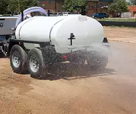 500 gallon express water trailer spraying off the back