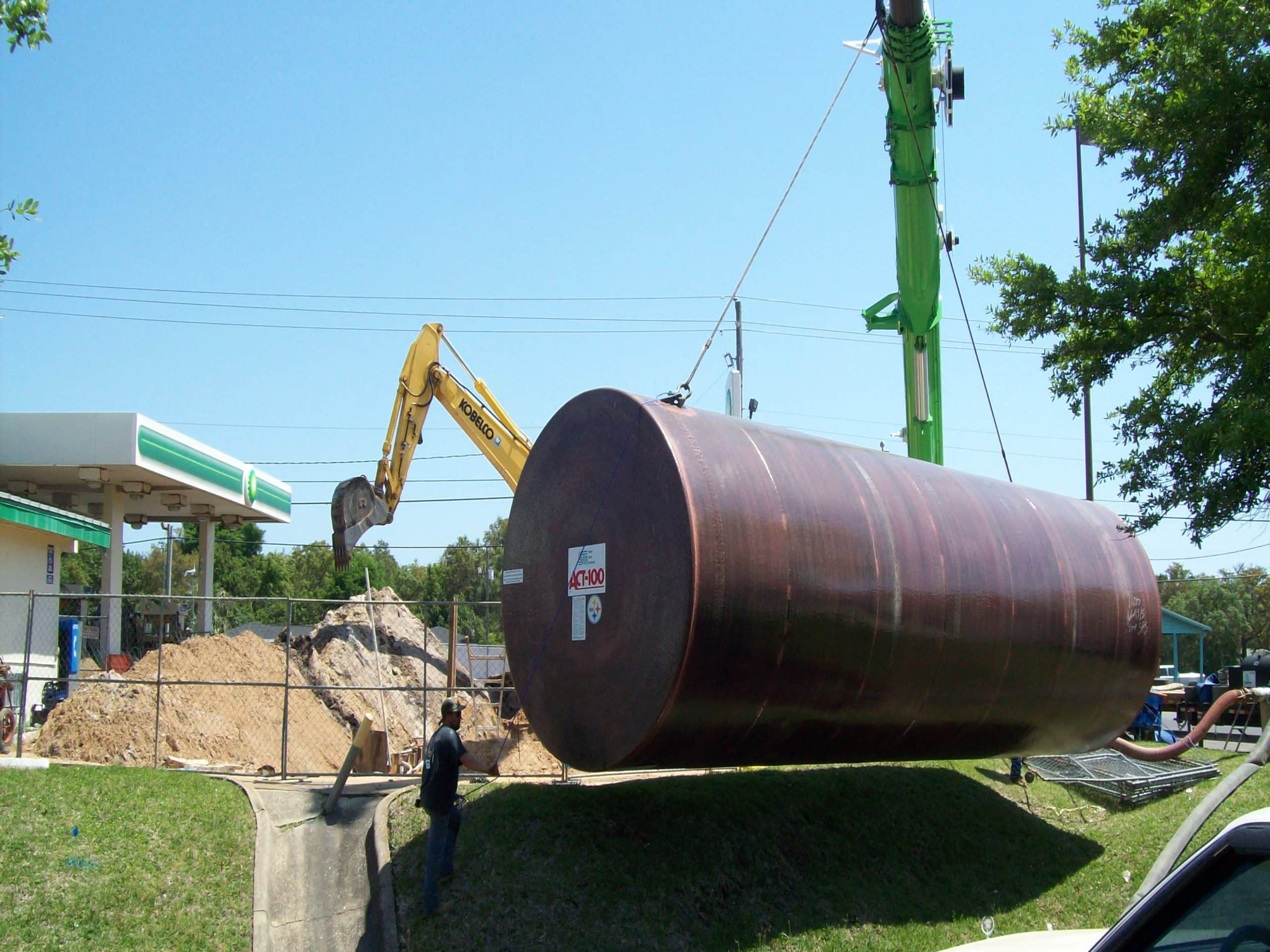 Large underground Act100® storage tank being installed at a fuel station construction site