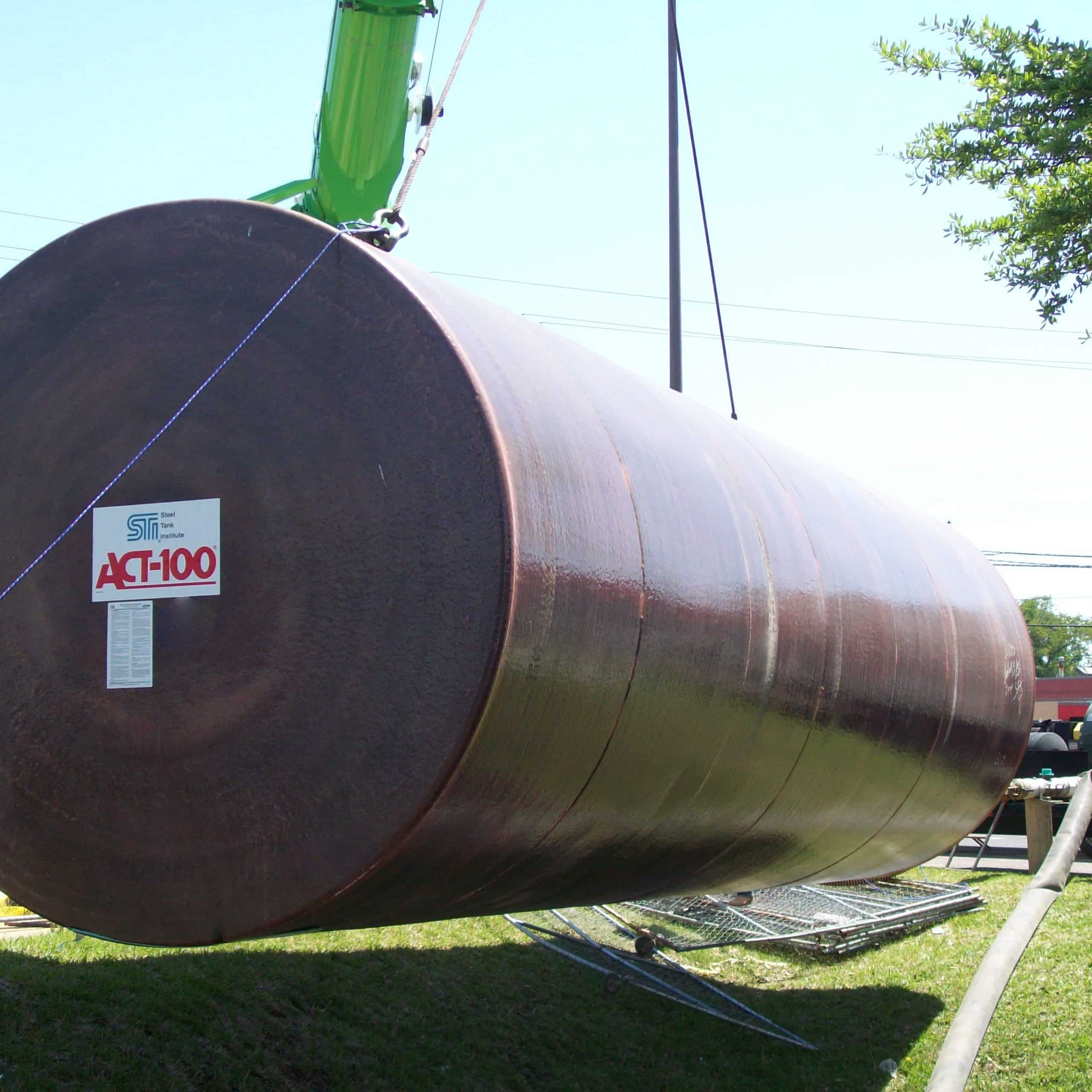 Act100® underground steel storage tank being lifted by a crane for installation