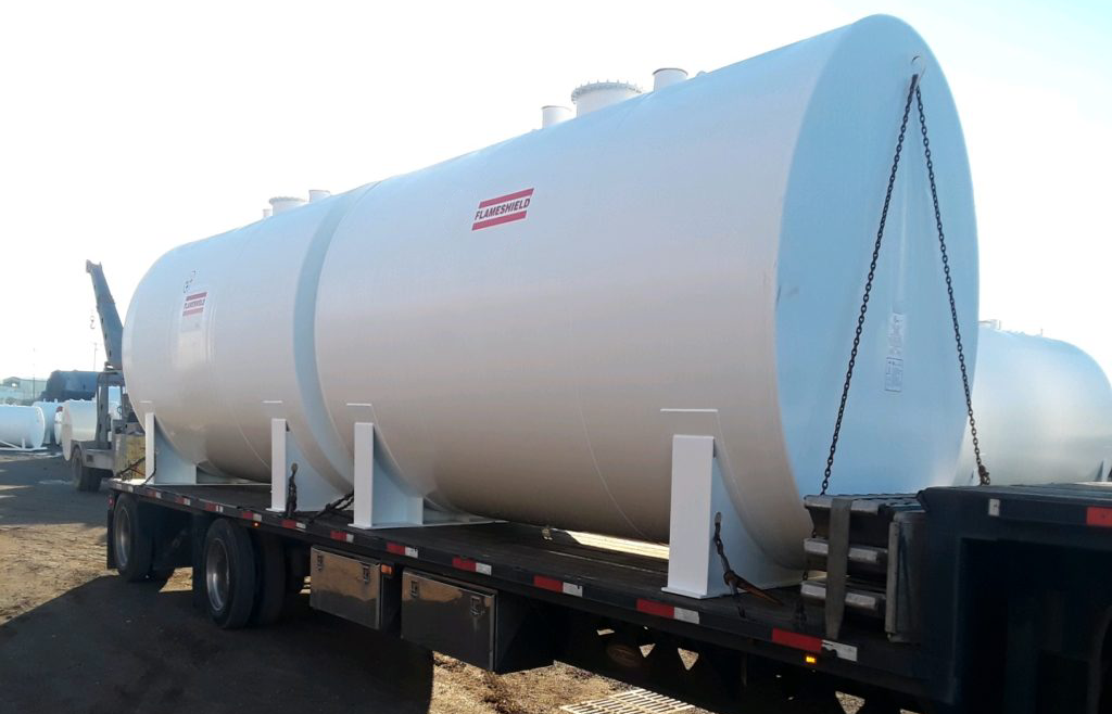 Fire-protected storage tanks for flammable liquids, meeting industry safety standards.