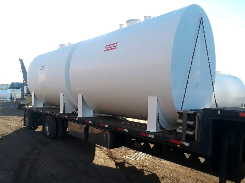 Large white Flameshield® tank on a flatbed truck, optimized for safe fuel storage and transport.